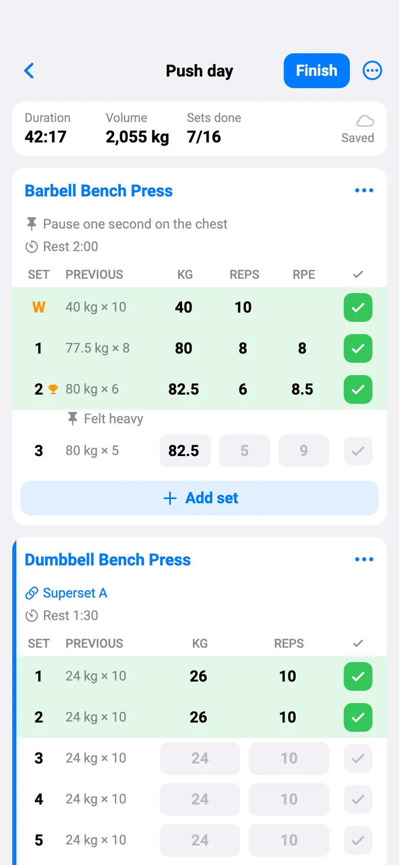 The same workout in English with the light theme: the Barbell Bench Press set table, with last time beside every set and a Finish button at the top.