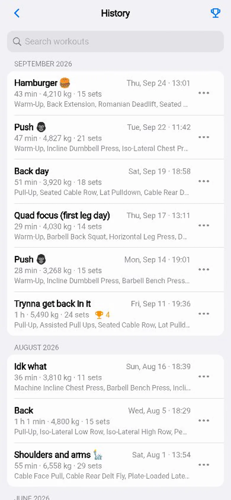 The History list: each workout with its length, volume and number of sets, and a trophy on the ones that set records.
